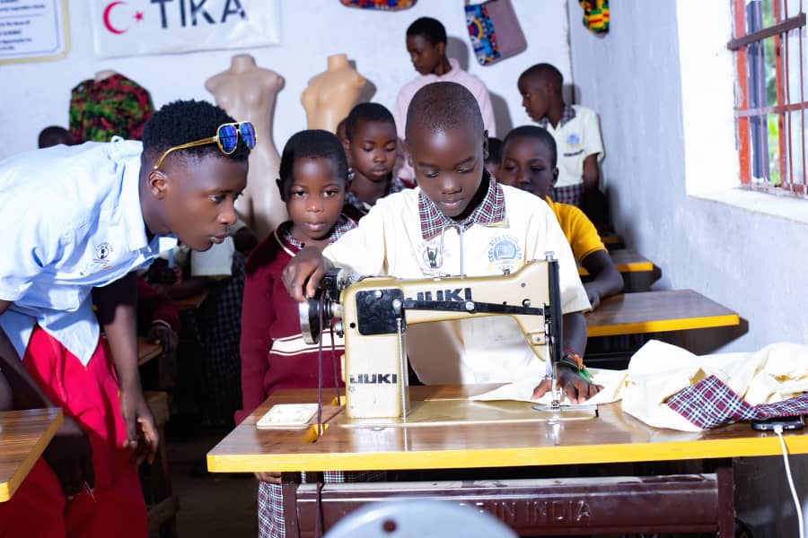 Students learning sewing